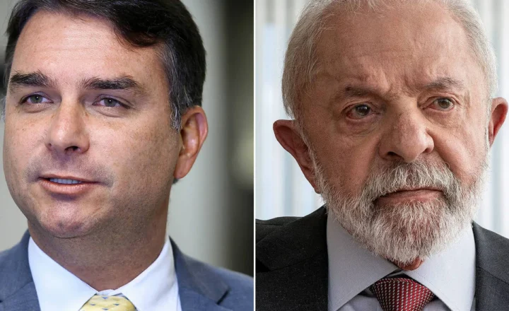 Dois homens aparecem em retratos lado a lado. O da esquerda é um homem de meia-idade com cabelo escuro, veste terno cinza, camisa branca e gravata amarela com padrão. O da direita é um homem mais velho, com cabelo e barba grisalhos, veste terno escuro, camisa branca e gravata vermelha com padrão. Am